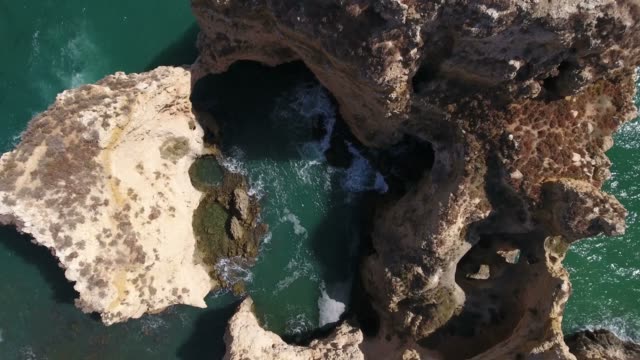 Aerial-view-of-Ponta-da-Piedade-rock-formations-in-Lagos,-Portugal