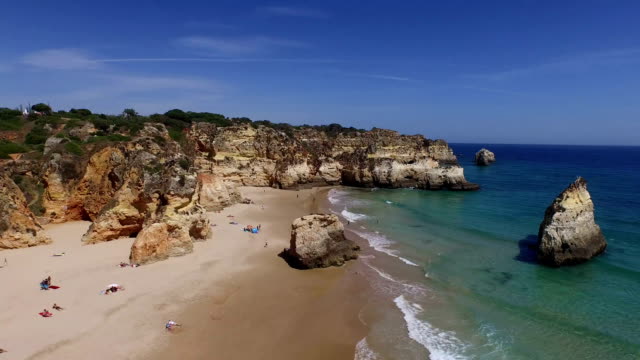 Aerial-from-natural-rocks-at-Praia-Tres-Irmaos-in-Alvor-Portugal
