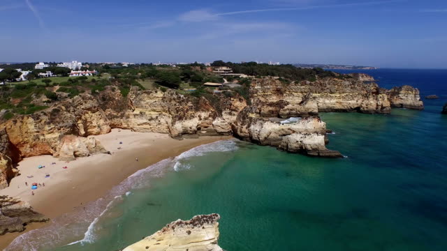 Aerial-from-natural-rocks-at-Praia-Tres-Irmaos-in-Alvor-Portugal