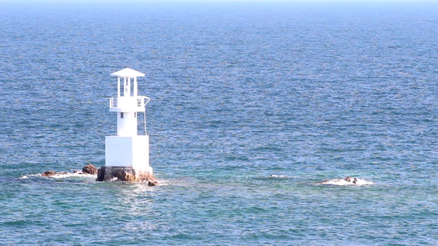 Lighthouse-in-the-ocean-with-blue-sky