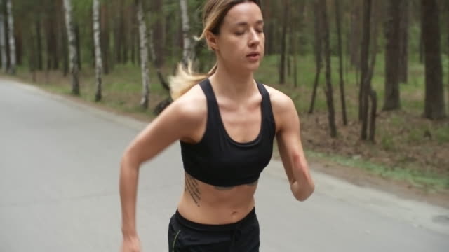 Fit-Sportswoman-Running-in-Park