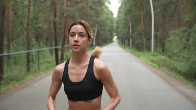 Fit-Sportswoman-Running-Outdoors