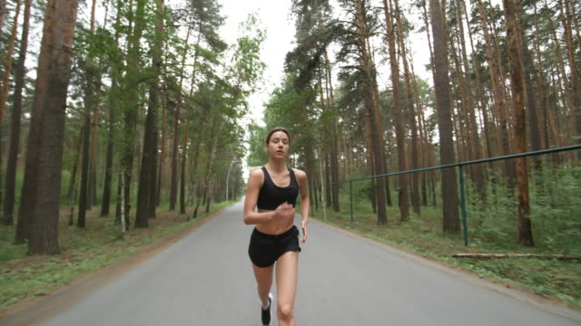 Young-Woman-Running-in-Forest