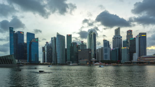 Singapore-city-skyline-with-landmark-buildings-day-to-night-timelapse-4K