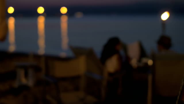 Beach-cafe-with-couple-in-the-evening