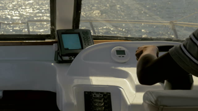 Captain-driving-yacht-in-the-sea