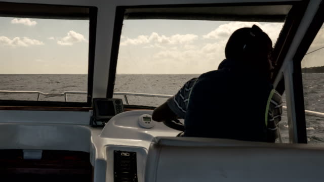 Timelapse-of-a-captain-steering-a-yacht