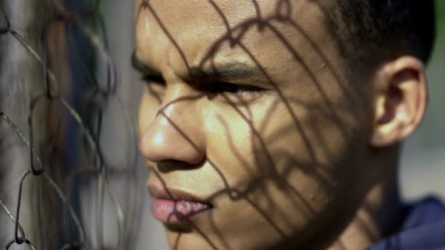 Mixed-race-teenager-looking-into-camera,-social-problems-of-migrants-adaptation