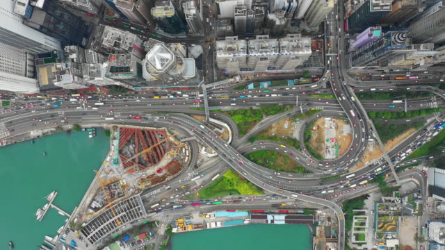 downtown-bay-traffic-road-junction-construction-victoria-harbour-aerial-topdown-panorama-4k-hong-kong