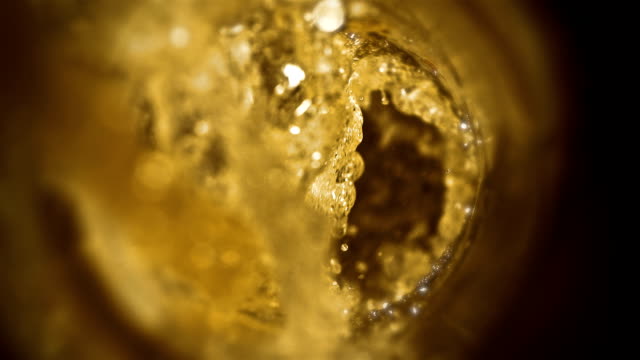 Closeup-slow-motion-pouring-beer-in-glass
