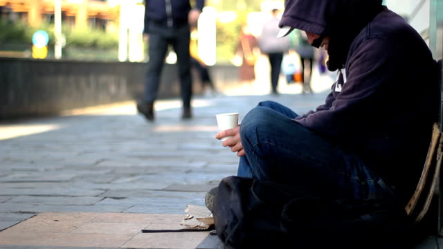 Homeless-beggar-man-begging-on-the-street