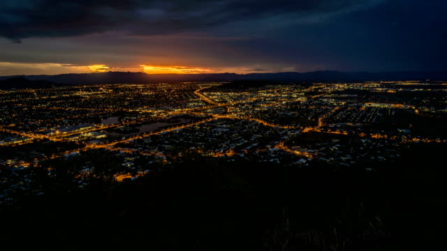 Timelapse-of-Townsville-city-at-night-with-storm-in-the-background,-Australia