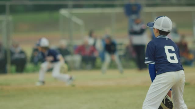 Slow-motion-of-a-kid-on-the-field-during-a-baseball-game