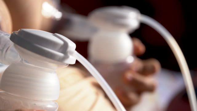 Close-up--mothers-using-automatic-breast-pump