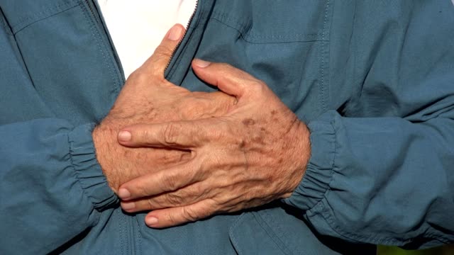 Elderly-Man-With-Heart-Attack-Or-Chest-Pain