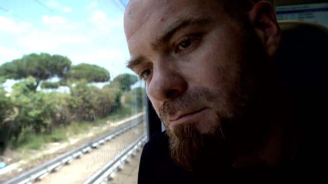 Pensive-and-sad-man-on-train:-problem,sadness,-depression