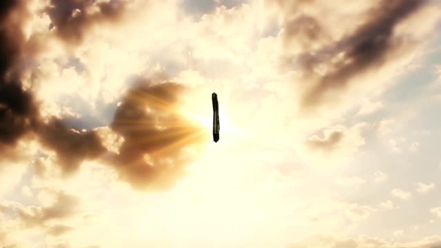 Cross-In-The-Sky-With-Moving-Clouds-and-Sun-Rays-In-The-Background.-Catholic-Religion-Concept