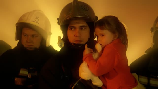 Firefighters-with-rescued-child