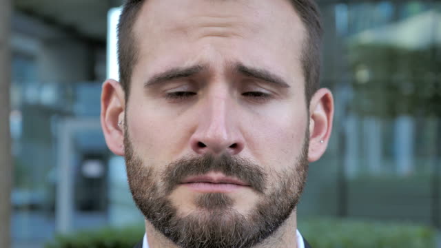 Face-of-Sad-Beard-Businessman