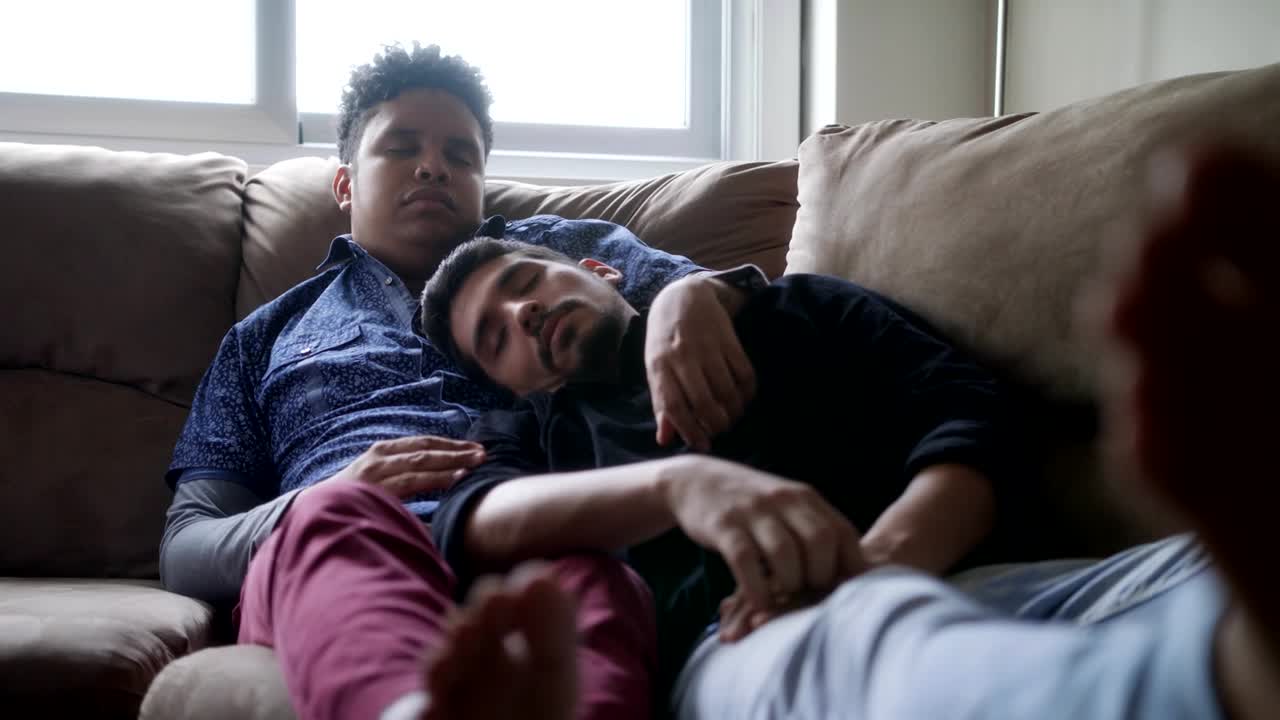 Young Gay Men Sleeping And Relaxing On Sofa At Home Free Stock Video  Footage Download Clips People