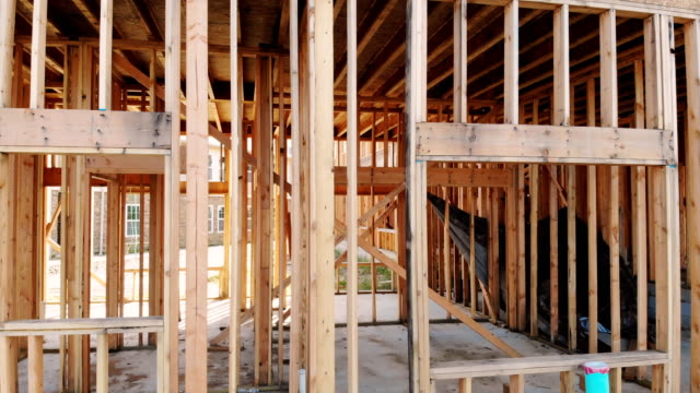 Framed-Close-Up-residential-Home-construction-a-wide-shot-of-a-new-home-construction-with-some-framed-wall-up