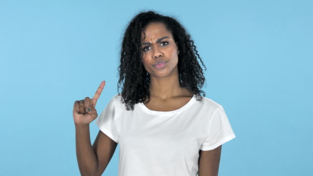 African-Girl-Waving-Finger-to-Refuse-Isolated-on-Blue-Background