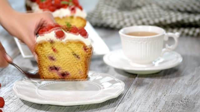 A-Slice-of-Summer-Pound-Cake-with-Raspberries-Topped-with-Sugar-Glaze.