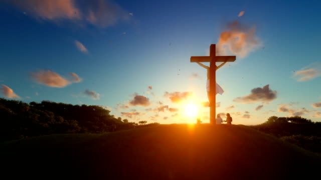 Jesus-on-cross-against-beautiful-sunset,-believers-praying
