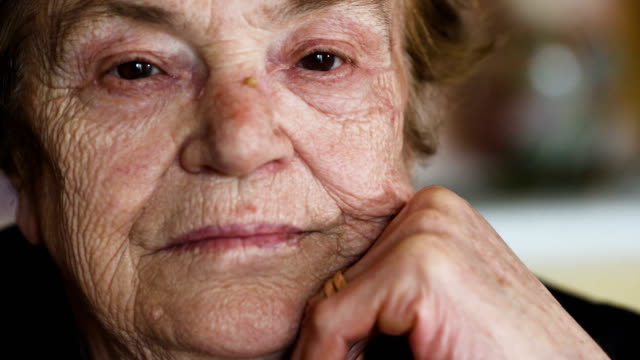pensive-and-sad-old-woman-opens-her-eyes.-Portrait-of-Thoughtful-elderly-woman