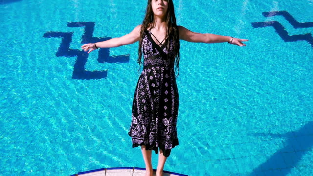Young-girl-in-dress-falling-to-swimming-pool