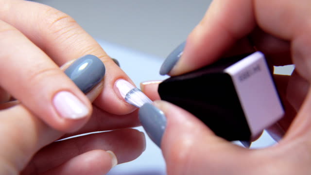Professional-manicure-procedure-in-beauty-salon