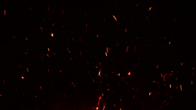 Beautiful-Burning-Hot-Sparks-Rising-from-Large-Fire-in-Night-Sky.-Abstract-Isolated-Fire-Glowing-Particles-on-Black-Background-Flying-Up.-Looped-3d-Animation.-Moving-Up.