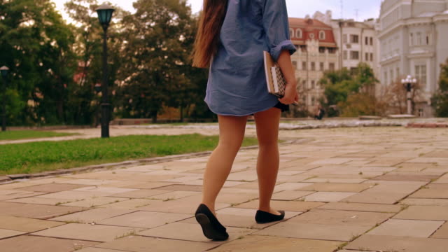 back-view-girl-walks-to-class