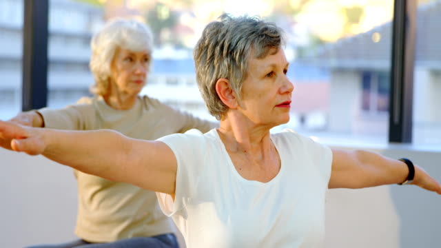 Senior-women-performing-yoga-4k