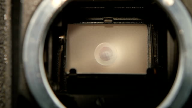 Shot-of-diaphragm-camera-shutter-blade-in-slow-motion,-closeup