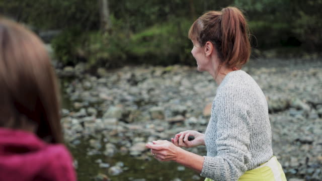 Two-Women-Skimming-Stones-on-the-Lake