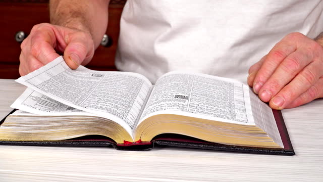 Man-reading-Bible-in-the-church