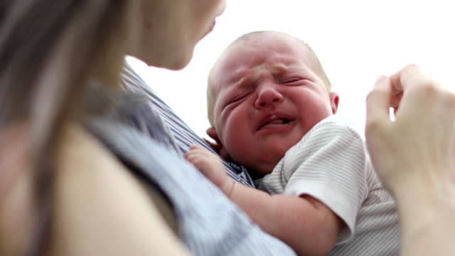 Mother-hushing-crying-baby