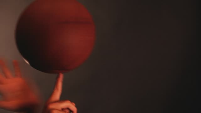 Basketball-ball-hand-dark-background