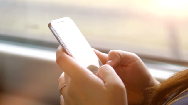 Woman-using-the-phone-in-the-train-in-4k-slow-motion-60fps