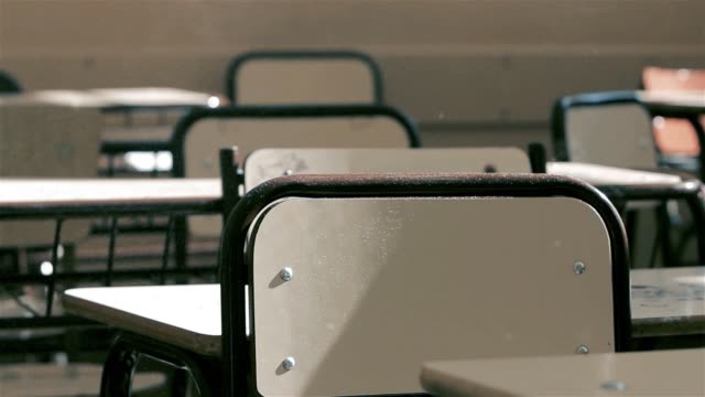 Vintage-Wooden-Chairs-With-Dust-Particles-In-The-School.