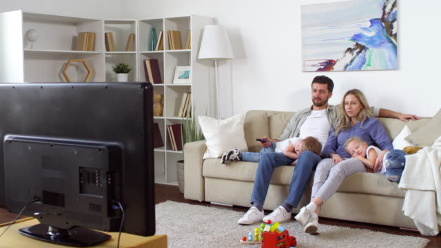 Couple-with-Children-Watching-TV