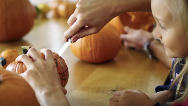 Drilling-small-pumpkins-for-Halloween