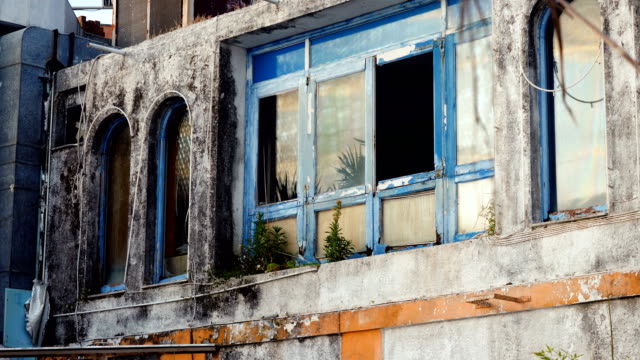 Architecture-of-Greece.-Broken-window-in-building-is-an-old-abandoned-hotel.-4K