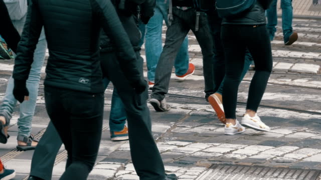 Feet-of-Crowd-People-Walking-on-the-Pedestrian-Crossing-in-Slow-Motion