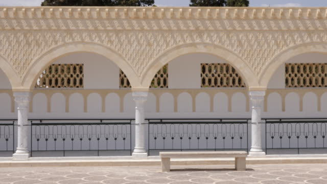 Panorama-rows-columns-with-arches-on-square-Habib-Bourguiba-in-Monastir-Tunisia.-Dolly-shot-exterior