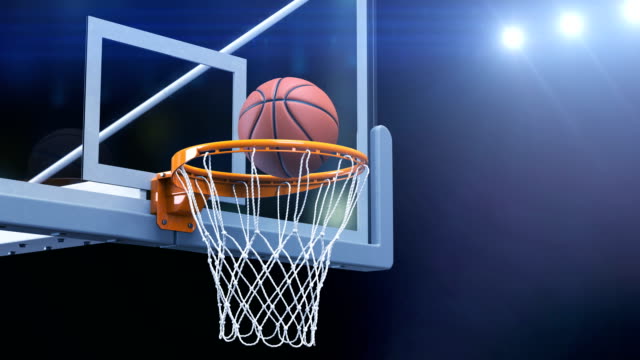 Beautiful-Basketball-Ball-Hits-Basket-Net-Slow-Motion-Close-up-Camera-Fly.-Ball-Flies-Spinning-into-Basketball-Hoop-with-Blue-Stadium-Lights.-Sport-Concept-3d-Animation