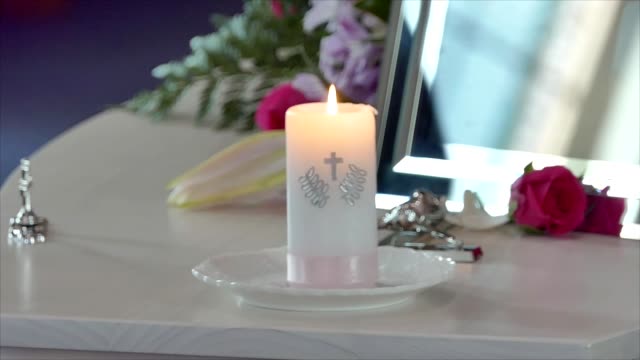 Shot-of-Flower-and-candle-used-for-a-funeral