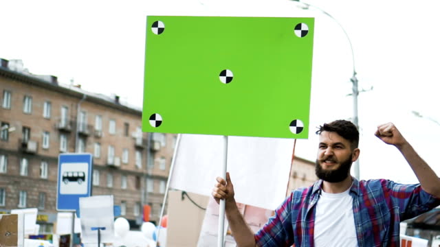 American-people-on-the-political-demonstration.-Banner-with-tracking-markers.