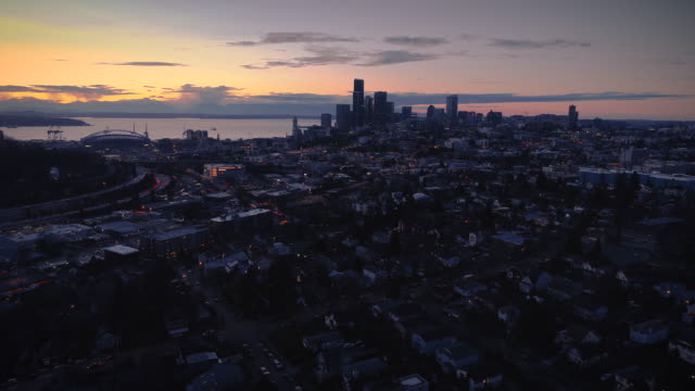 Dark-Night-Cityscape-Aerial-with-Oceanfront-Sunset